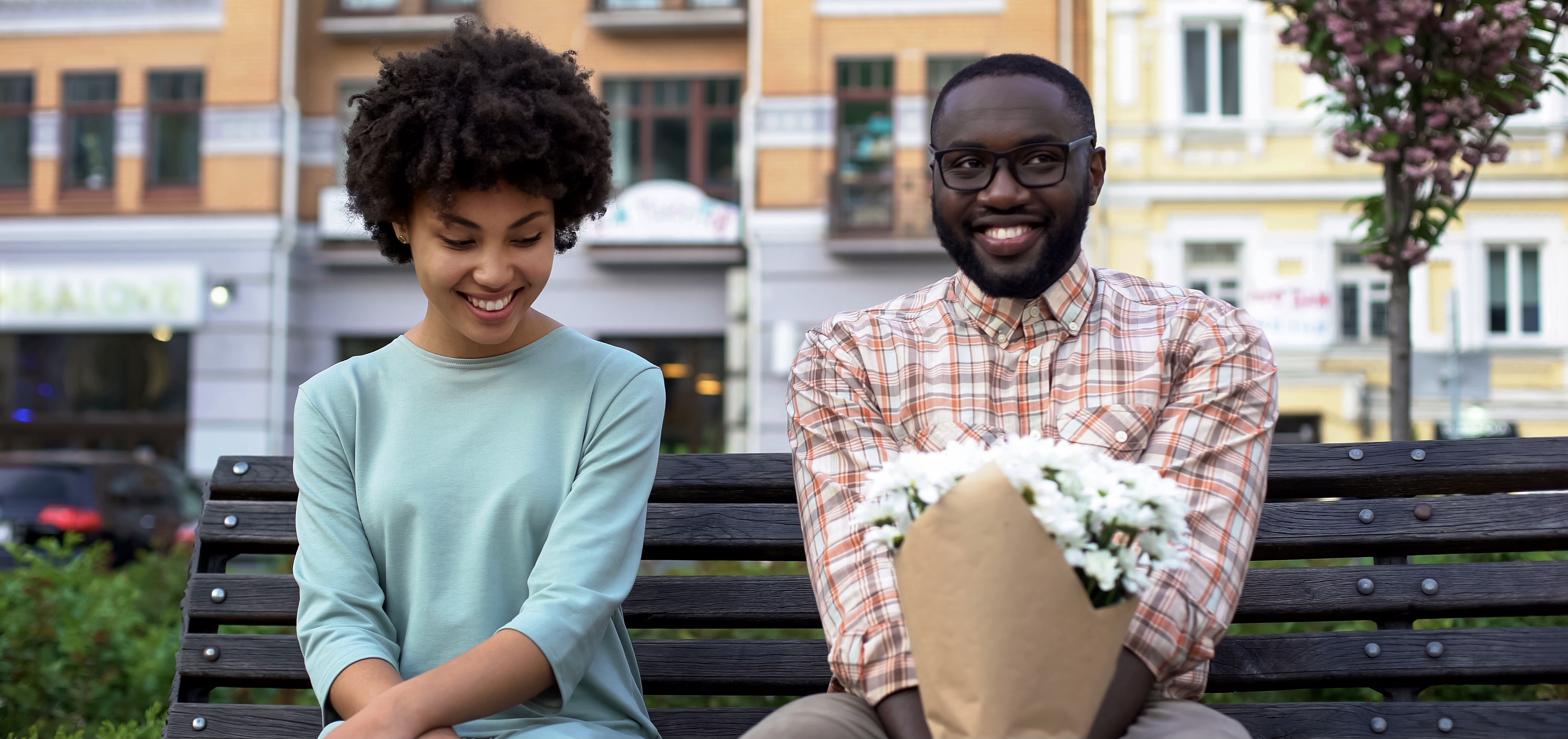 man and woman on date looking nervous