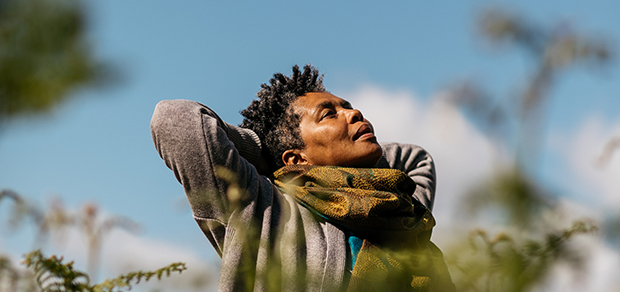 woman looking to the sky with a sense of release