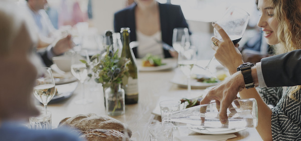 Friends at a party sharing a meal