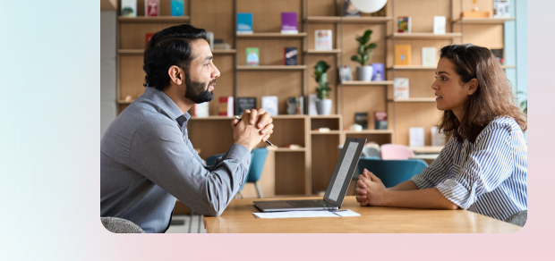 manager and employee talking in the office