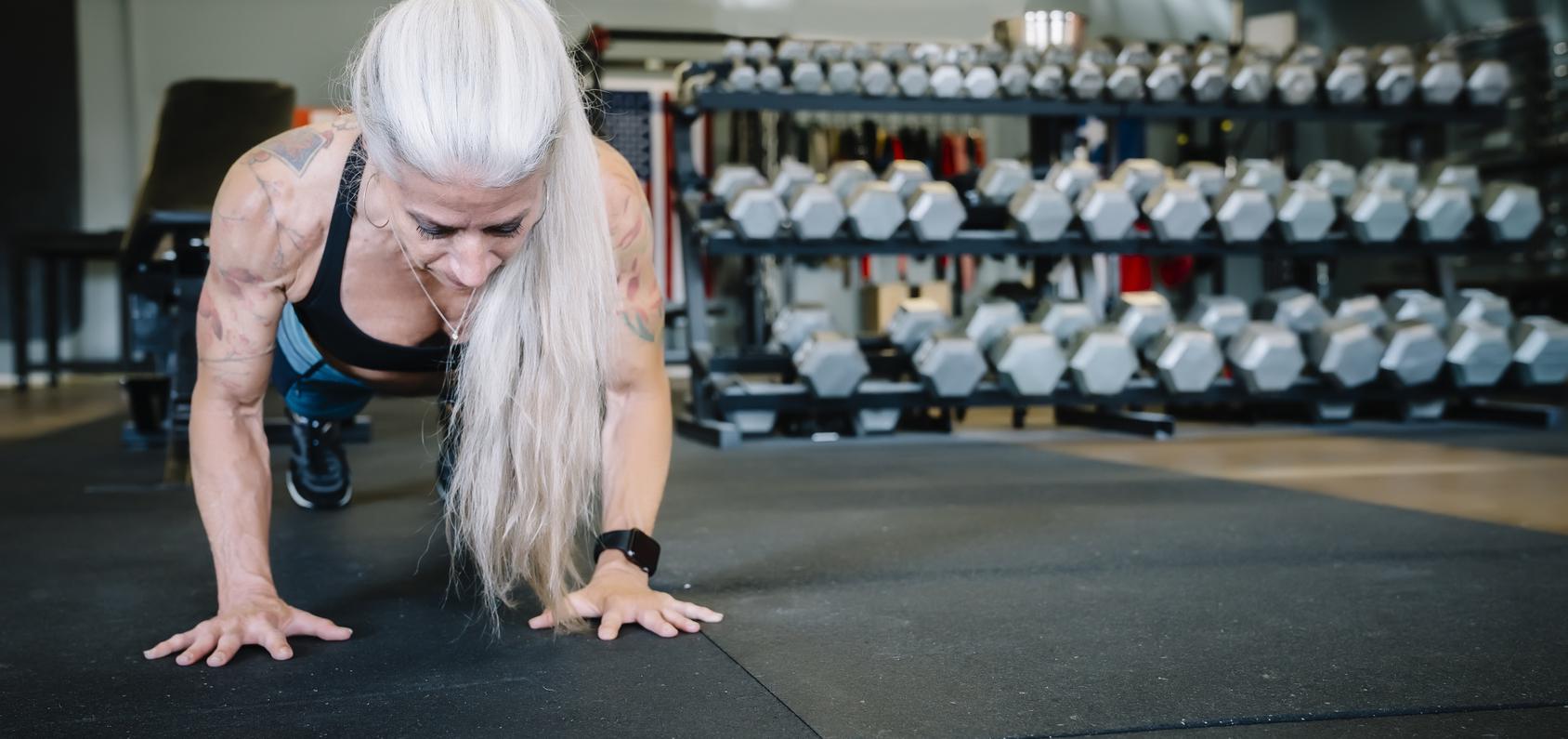 Strong woman doing push ups.