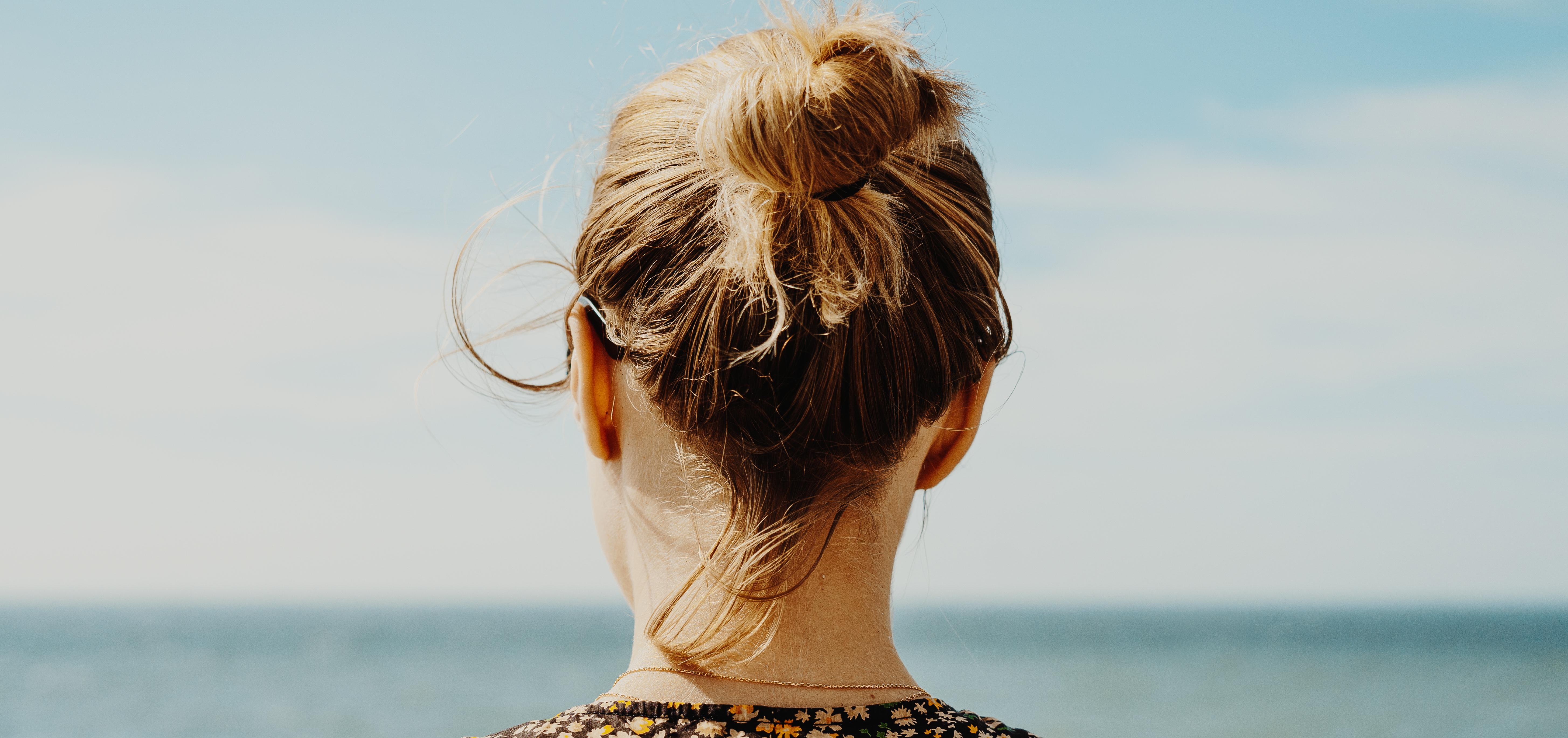 woman looking out into the water