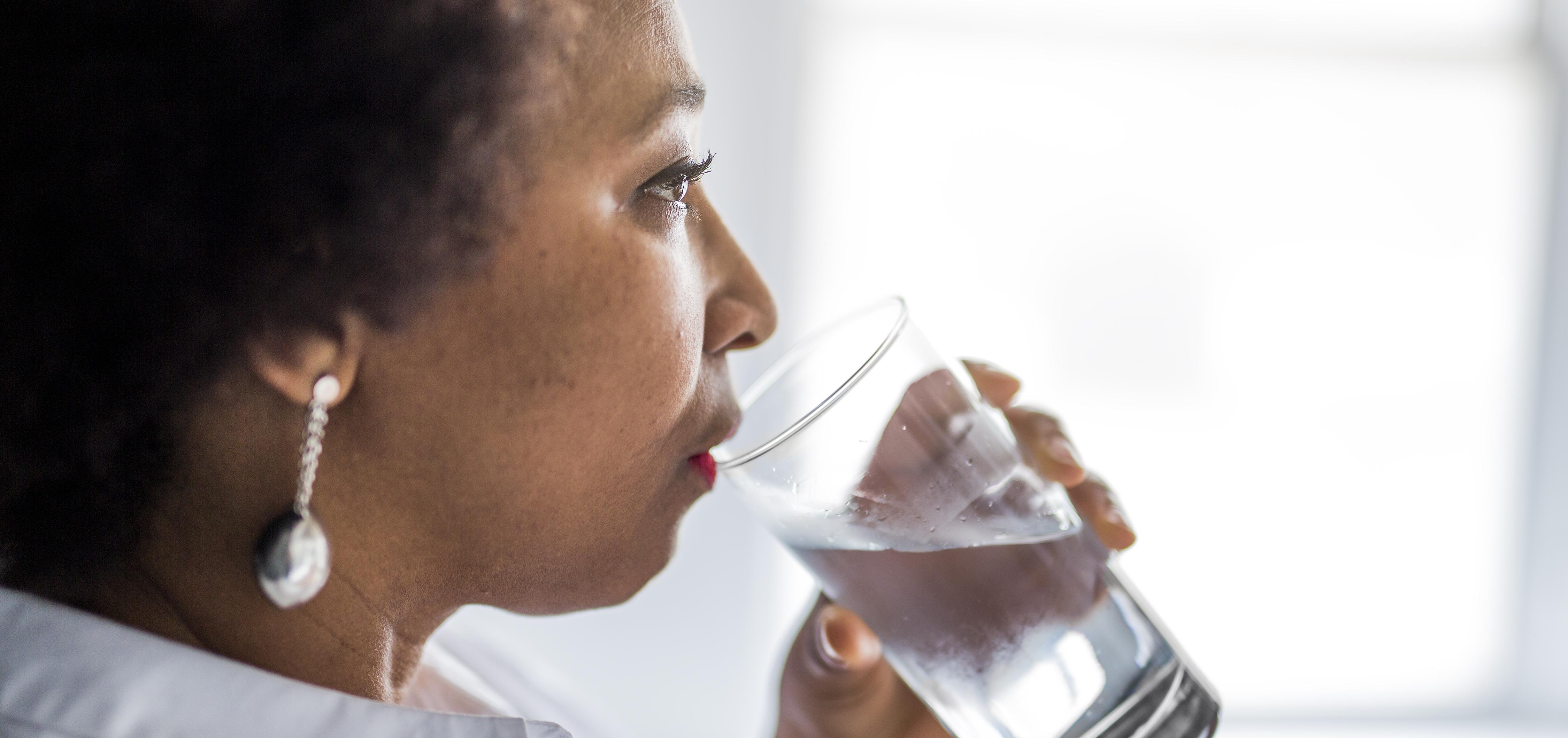 Woman drinking a glass of water