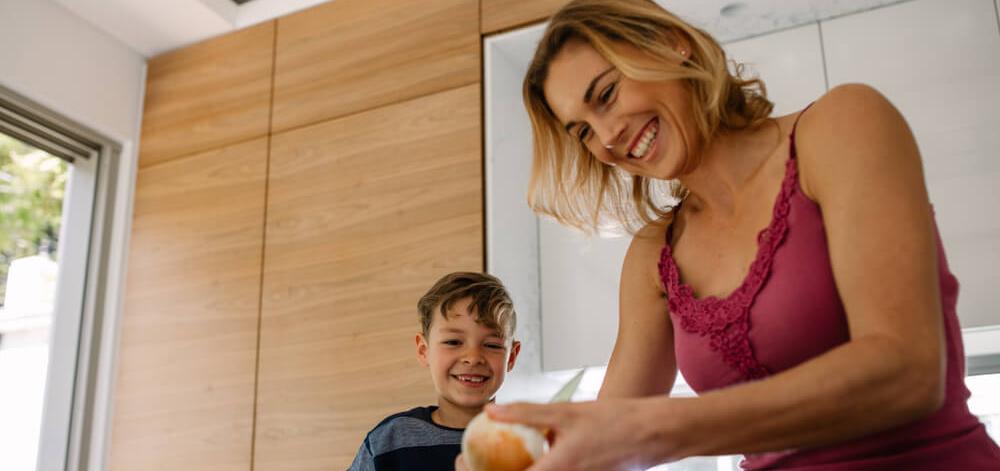 Mother and son in the kitchen preparing a healthy meal for type 1 diabetes
