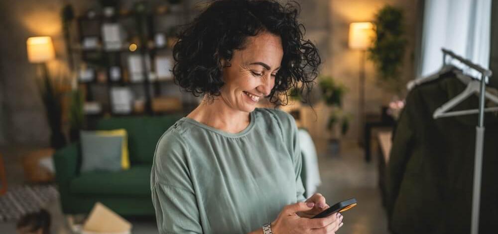 woman reading on her phone