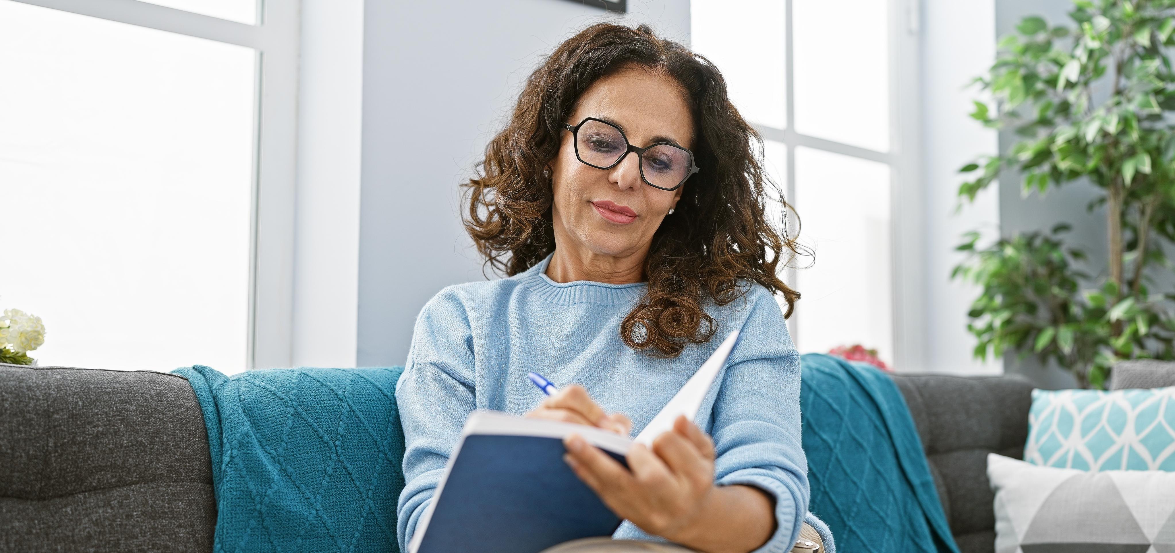 woman writing in journal