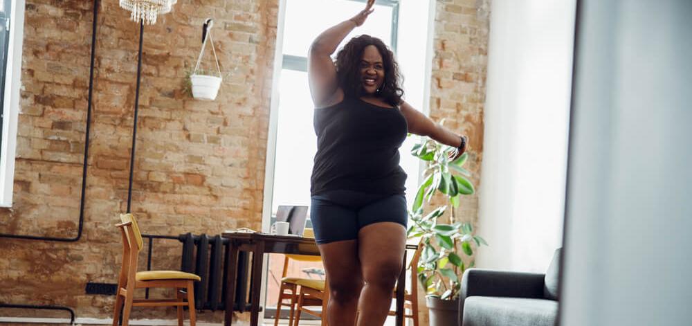Woman exercising in her home