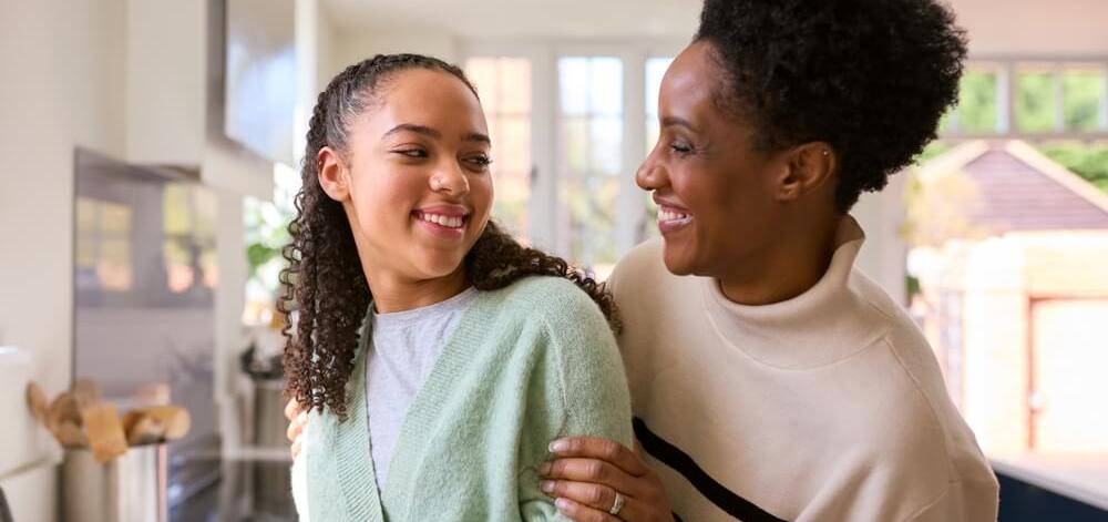 Mother and teenage daughter in the kitchen