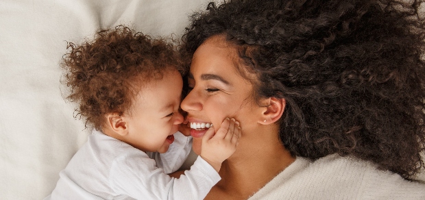 mother and baby laughing