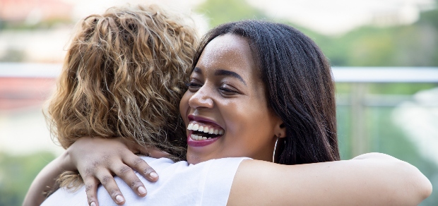 two women hugging each other